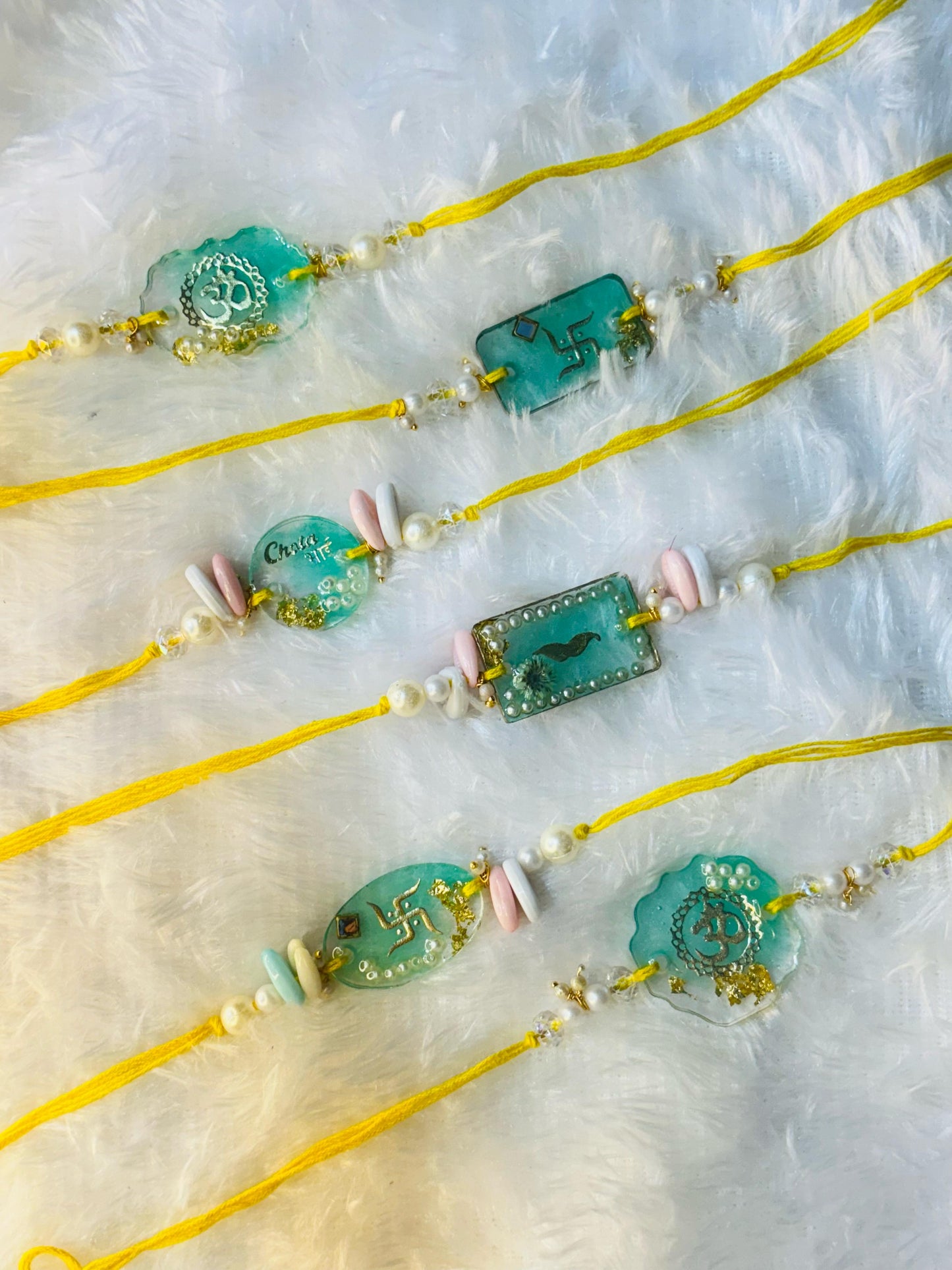 Spiritual Resin Rakhi Set – Sacred Symbols & Premium Design. Set of FIVE
