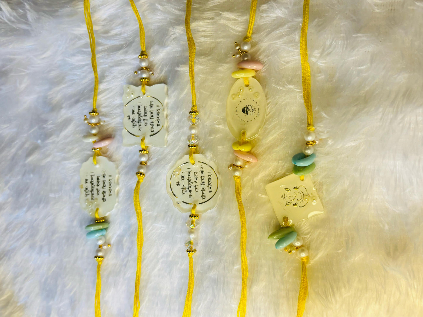 Spiritual Resin Rakhi Set – Sacred Symbols & Premium Design. Set of FIVE